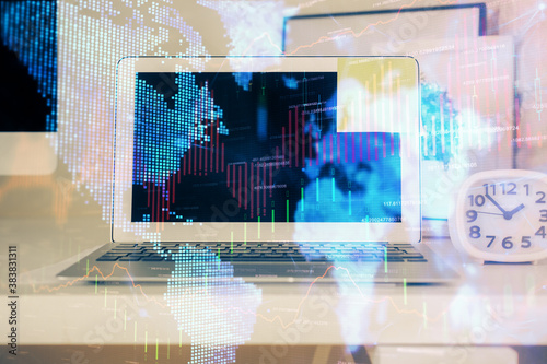 Financial chart drawing and table with computer on background. Multi exposure. Concept of international markets.