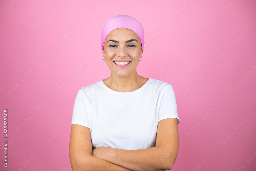 Young beautiful woman wearing pink headscarf over isolated pink background with a happy face standing and smiling with a confident smile showing teeth with arms crossed Young beautiful woman wearing pink headscarf over isolated pink background with a happy face standing and smiling with a confident smile showing teeth with arms crossed