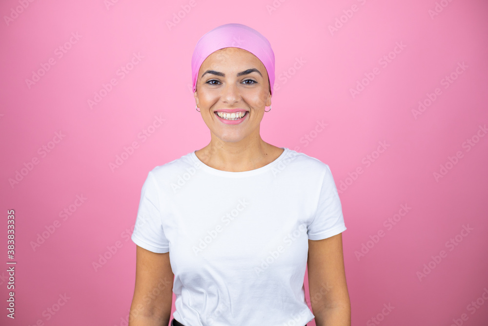Young beautiful woman wearing pink headscarf over isolated pink background with a happy face standing and smiling with a confident smile showing teeth Young beautiful woman wearing pink headscarf over isolated pink background with a happy face standing and smiling with a confident smile showing teeth