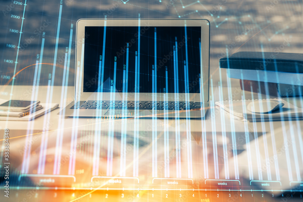 Financial market graph hologram and personal computer on background. Multi exposure. Concept of forex. Financial market graph hologram and personal computer on background. Multi exposure. Concept of forex.