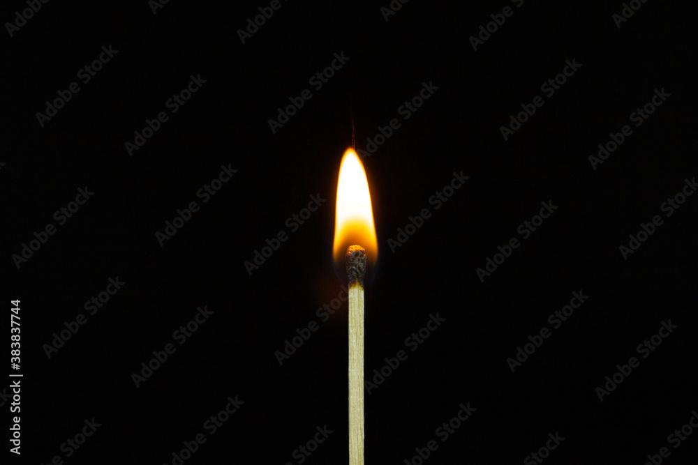 close up Single matchstick burning isolated on black background. close up Single matchstick burning isolated on black background.