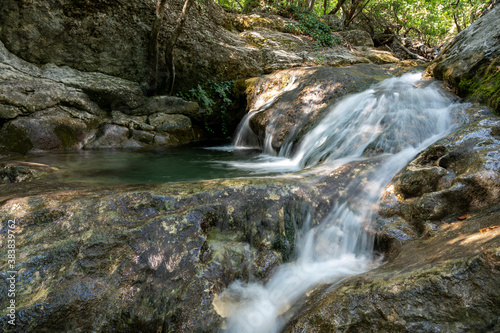 Mountain stream  mountain waterfall  waterfall in the forest  rocky river  waterfall in the mountains