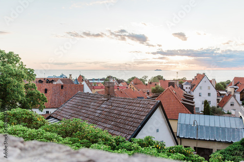 Roofs of town houses at sea photo