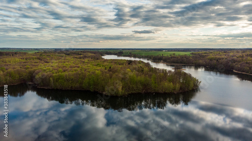 The view from the drone to the lake  reflected clouds in the water at sunset.