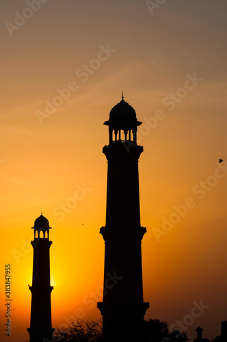 Sunset behind the minarets of a mosque 