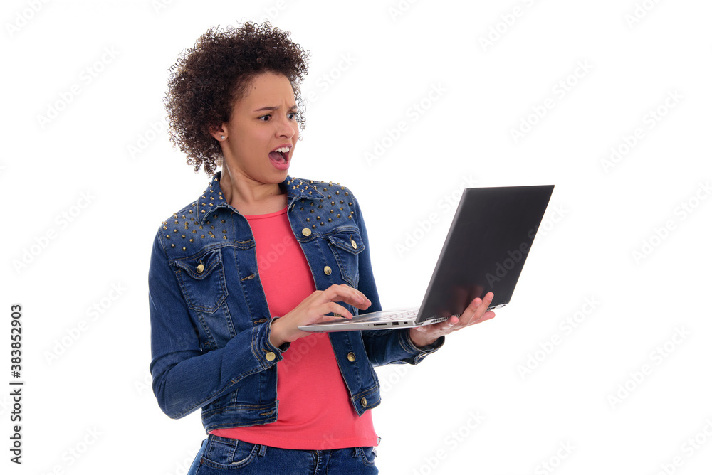 portrait of a young brazilian woman holding laptop with surprised expression, isolated on white background. portrait of a young brazilian woman holding laptop with surprised expression, isolated on white background.