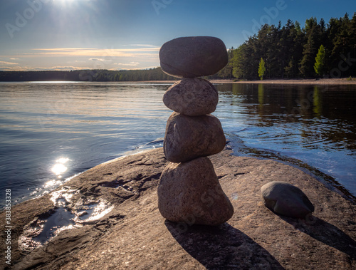 Zen like mindfulness rock formations by the beautiful Lake Saimaa Finland. Silent clam lake.