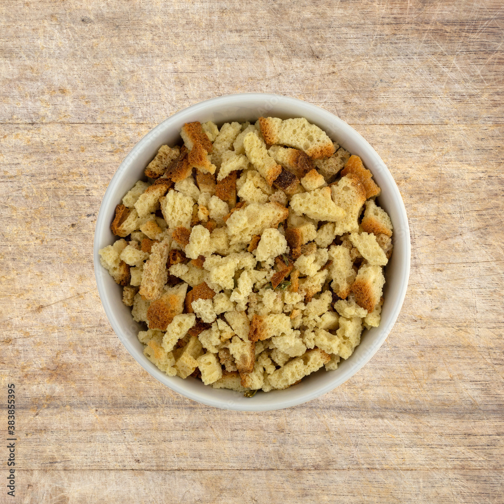 Bowl of stovetop stuffing on an old cutting board Bowl of stovetop stuffing on an old cutting board