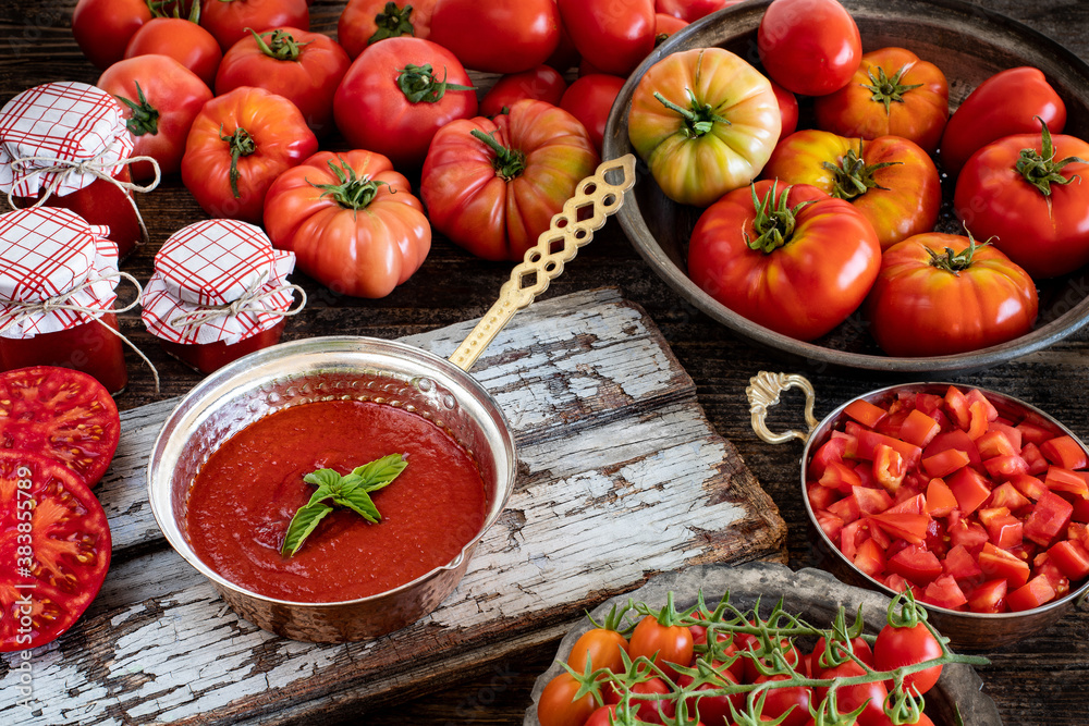 Many sliced tomatoes on the kitchen counter Many sliced tomatoes on the kitchen counter