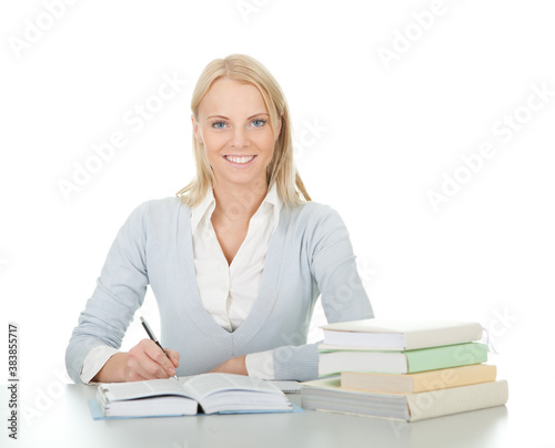 Bild auf Leinwand Beautiful student girl doing homework