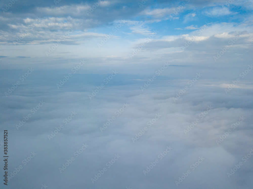 Aerial drone flight over the fog. There are thick clouds of fog below, cloudy. Aerial drone flight over the fog. There are thick clouds of fog below, cloudy.