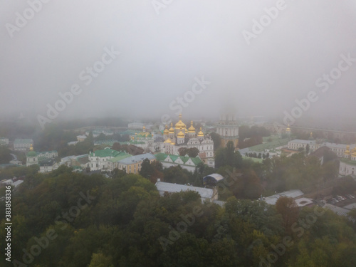 Aerial drone view. Kiev Pechersk Lavra in a dense fog.