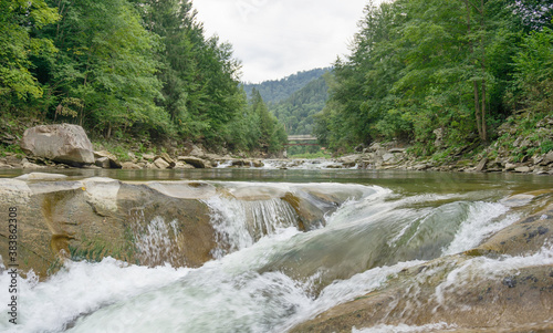 Rocky waterfall in scenery forest