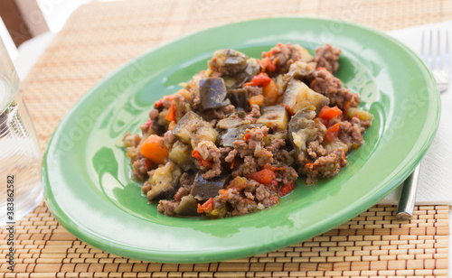 dish of vegetable stew. stewed eggplant, minced meat, carrots, peppers, onion squid