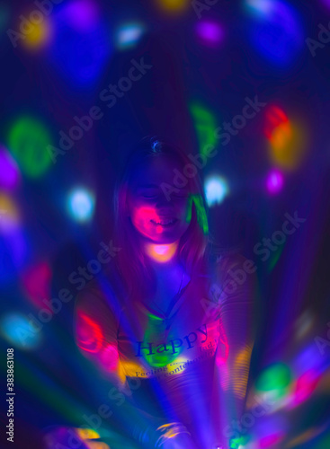 happy girl in club lighting