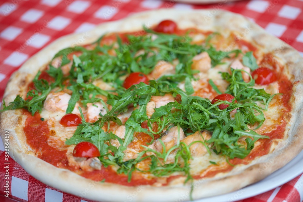 Macro image of salmon rucola pizza