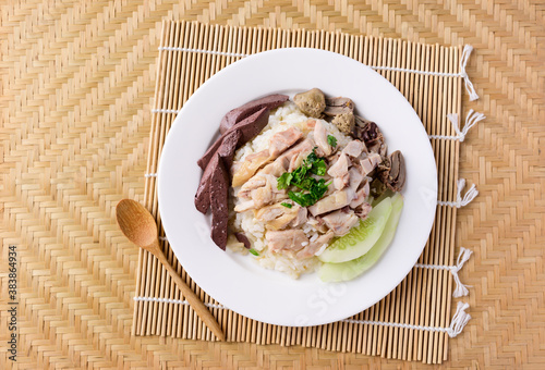 Thai food (Khao Man Kai), Hainanese chicken rice on plate with spoon ready to eating, Top view