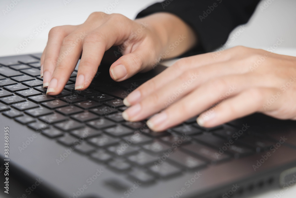 Woman working at home office hand on keyboard close up Woman working at home office hand on keyboard close up