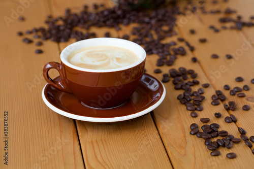 cup of coffee on wooden table photo