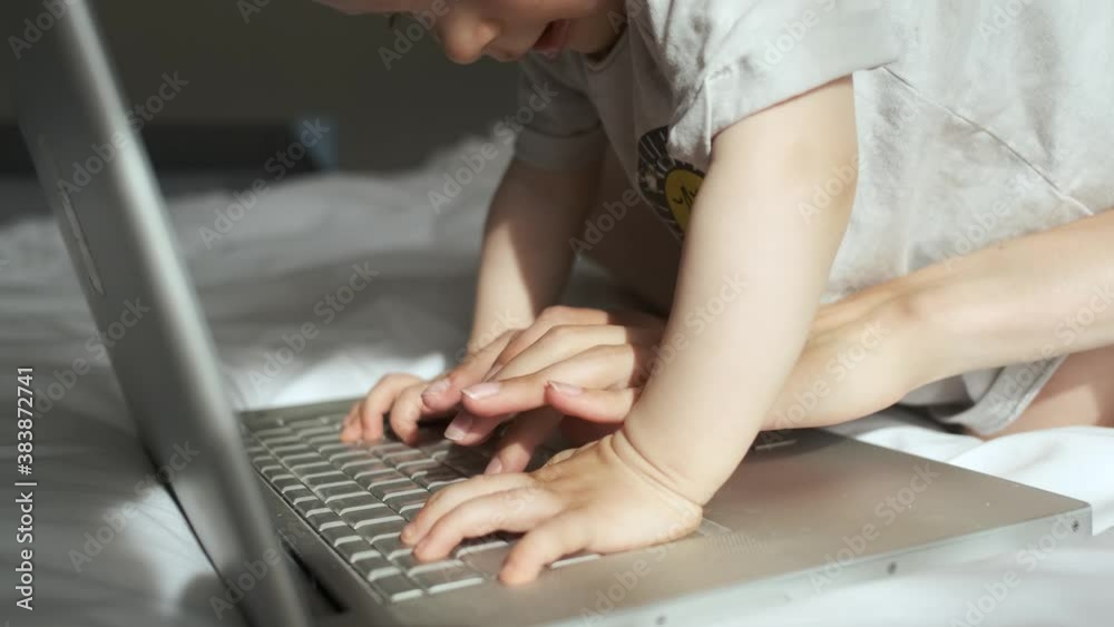 close-up baby interferes with laptop work close-up baby interferes with laptop work