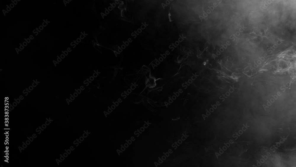 Puffs of white thick cigarette smoke on black background. Puffs of white thick cigarette smoke on black background.