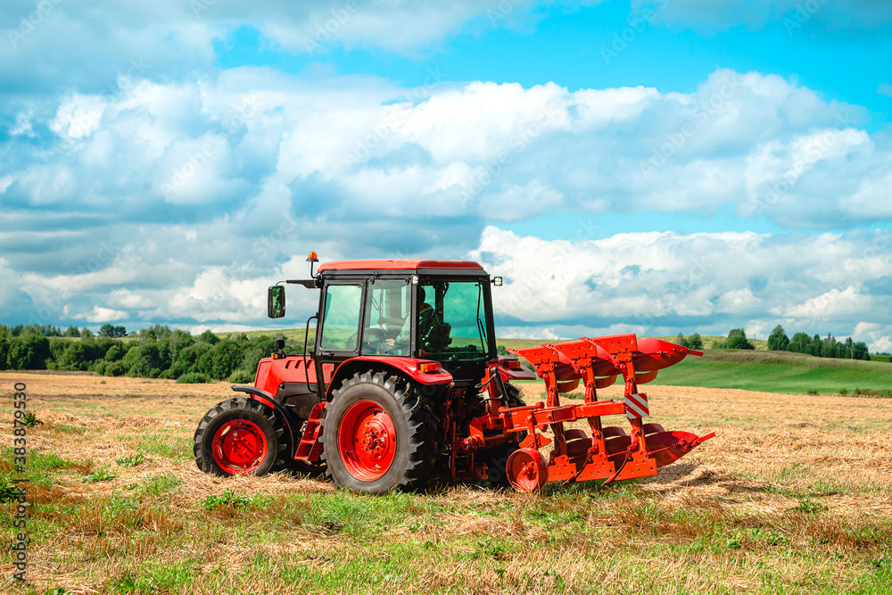 farmer on a tractor plowing the land