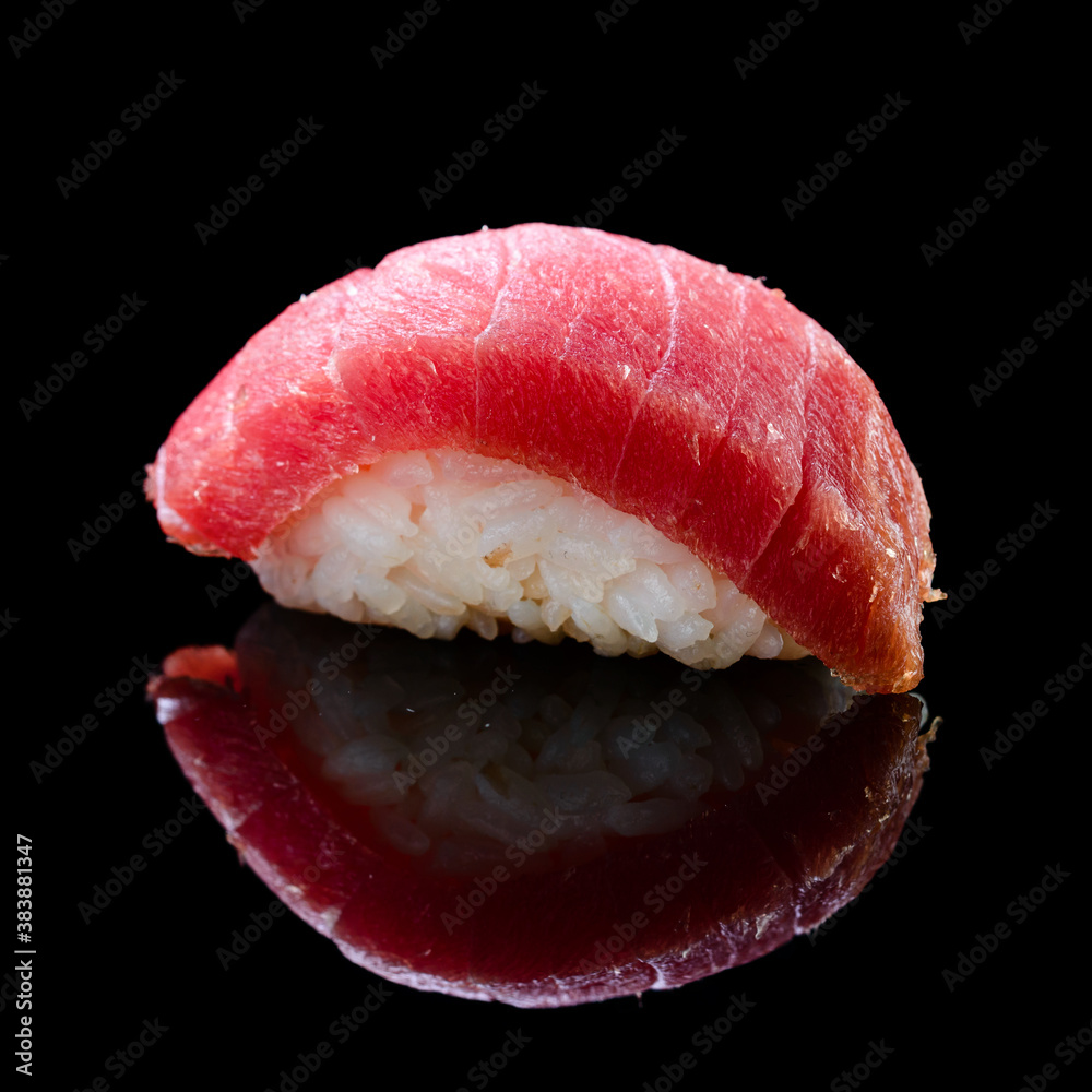 sushi with tuna on a black background with reflection sushi with tuna on a black background with reflection