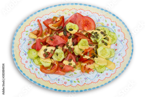 Mediterranean salad with tomato cucumber pumpkin seeds