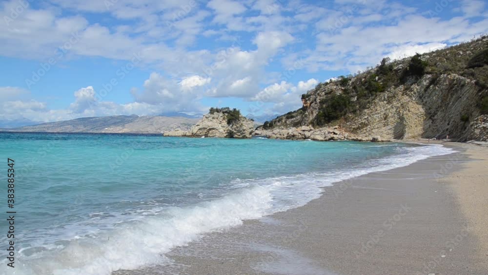 Beautiful sandy beach, Ionian sea, Albania. Seascape and coastline near Sarande. Waves crashing on beach in Ksamil. Beautiful sandy beach, Ionian sea, Albania. Seascape and coastline near Sarande. Waves crashing on beach in Ksamil.