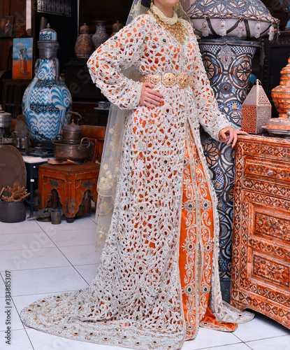 The Moroccan caftan is a Moroccan women's traditional costume. It is considered one of the oldest traditional clothes in the world. photo