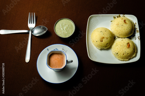 Rava idli with chutney and Tea on the table photo