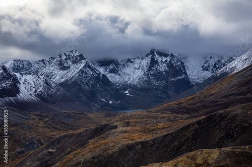 Beautiful View of Scenic Mountains and Landscape in Canadian Nature. Season change from Fall to Winter. Taken in Tombstone Territorial Park, Yukon, Canada.