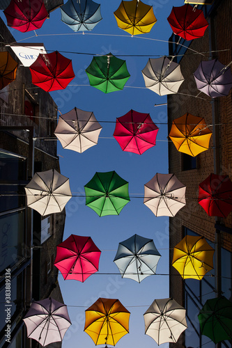 Obraz na płótnie A row of umbrellas suspended in a street in Dublin, Ireland w salonie