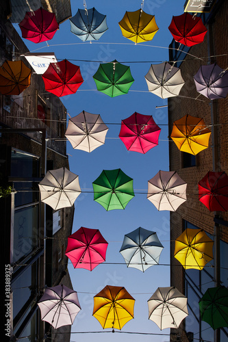 Obraz na płótnie A row of umbrellas suspended in a street in Dublin, Ireland w salonie