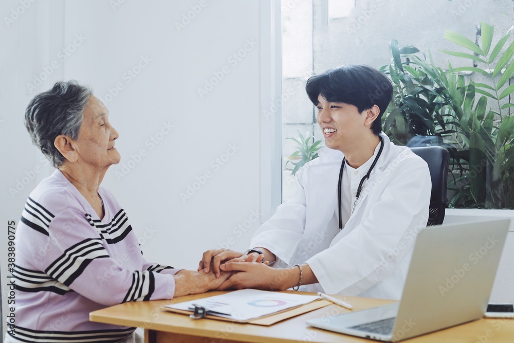 Young doctor examining elderly woman in hospital. Young doctor examining elderly woman in hospital.