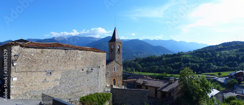 Panoramic view of romanesque church of Sant Esteve de Prullans in the village of Prullans. Prullans, La Cerdanya, Serra del Cadí, Catalonia.