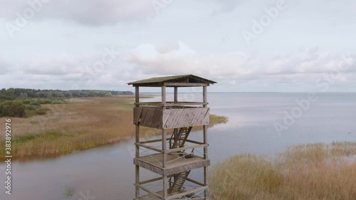 Aerial drone flying above wooden watchtower Vortsjarv lake in Estonia, Europe photo