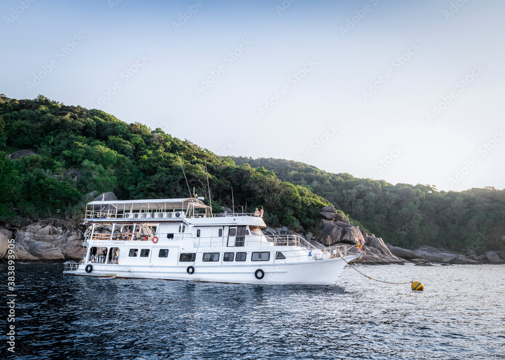 Tourist ship near one of the Similan Islands in Thailand Tourist ship near one of the Similan Islands in Thailand