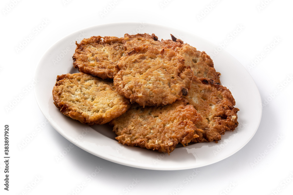 Traditional Jewish latkes or potato pancakes isolated on white background Traditional Jewish latkes or potato pancakes isolated on white background