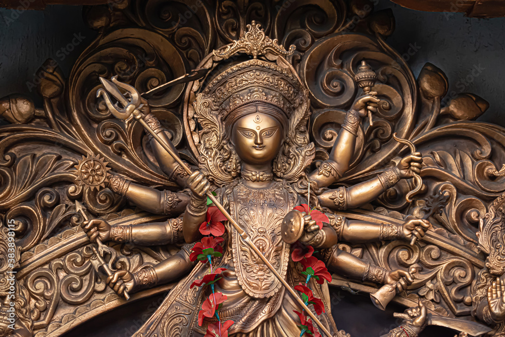 Fototapeta premium Idol of Goddess Devi Durga at a decorated puja pandal in Kolkata, West Bengal, India.