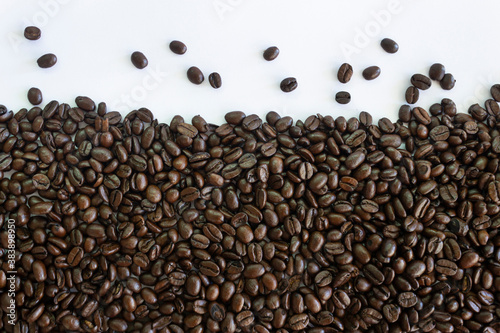 Roasted coffee beans on white background.Creative background concept.