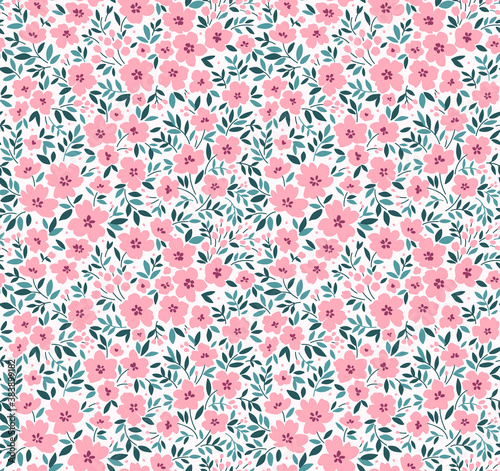 Floral pattern. Pretty flowers on white background. Printing with small pink flowers. Ditsy print. Seamless vector texture. Spring bouquet.