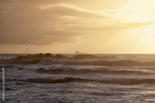 Ship on the horizon at sunset