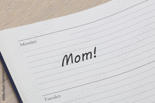 Mom reminder note in a diary page