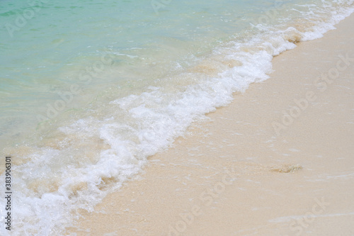 Sandy beach with ocean wave