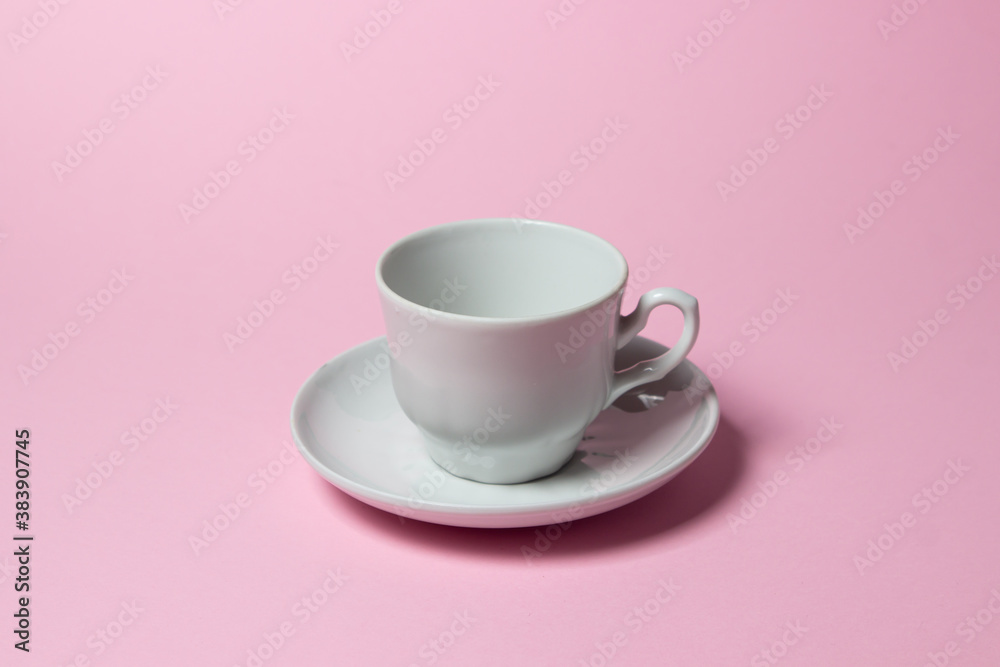Coffee cup on a pink background. Coffee cup and saucer. Coffee cup on a pink background. Coffee cup and saucer.