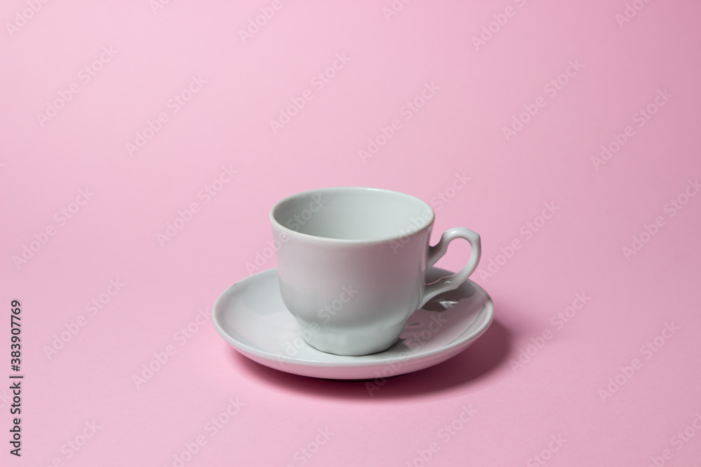 Fototapeta premium Coffee cup on a pink background. Coffee cup and saucer.