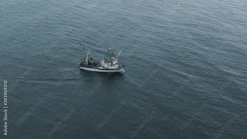 Fishing Trawler Sailing On The Saint Lawrence River At Early Morning In Quebec, Canada. - aerial drone shot Fishing Trawler Sailing On The Saint Lawrence River At Early Morning In Quebec, Canada. - aerial drone shot