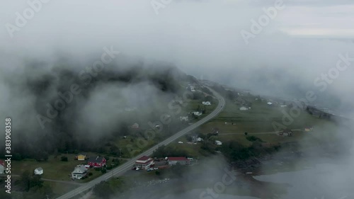 Overclouded At The Village By Chic-Choc Mountains In Saint Lawrence River, Gaspesie Peninsula, Quebec Canada At Early Morning. - Aerial Drone Shot photo