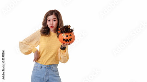 Portrait of Asian woman holding curved pumpkin and looking at pumpkin isolated over white background Halloween concept.